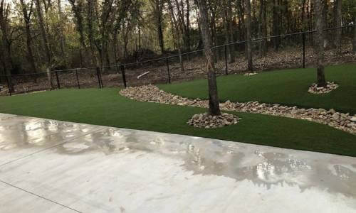 Artificial grass park area with fence