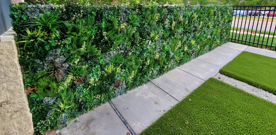 Artificial living wall by fence